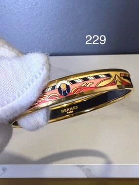 Hermès Gold Enamel Bangle with Pink, Yellow & Black Motif
